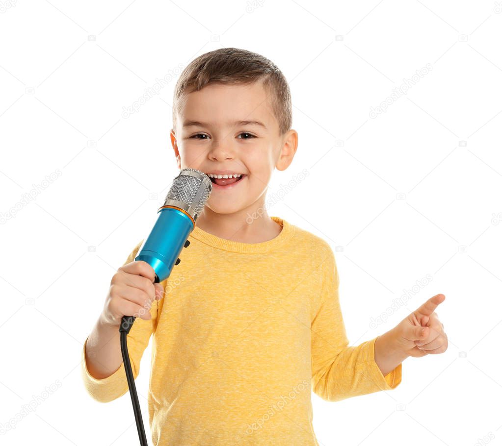 Cute funny boy with microphone on white background