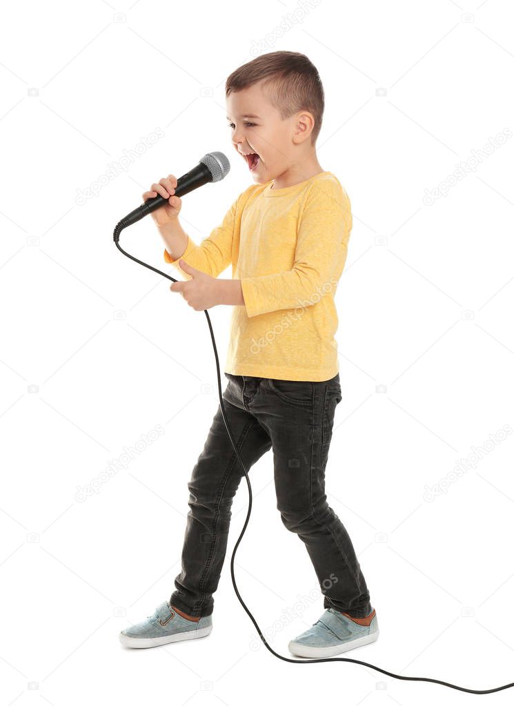 Cute funny boy with microphone on white background