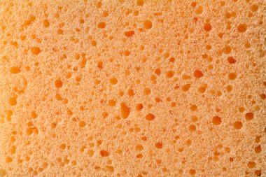Bir arka plan, closeup olarak turuncu sünger doku