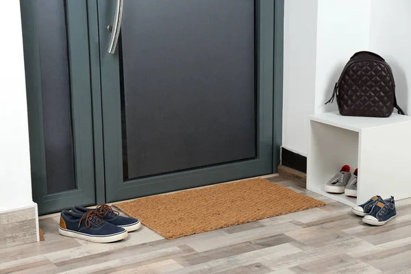 Rubber Boots Umbrella Mat Door Hallway Stock Photo by ©NewAfrica