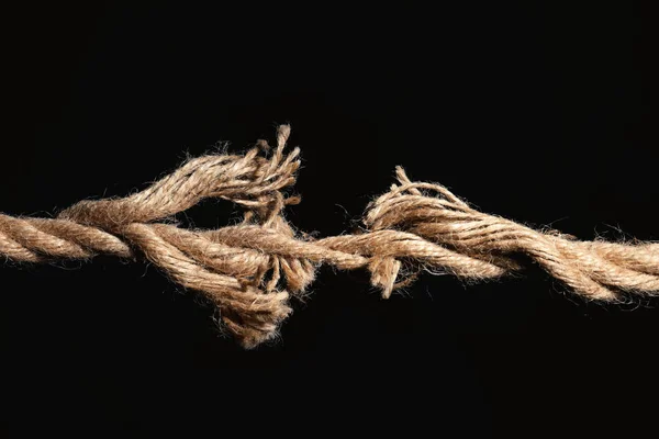 Rupture of cotton rope on black background — Stock Photo, Image