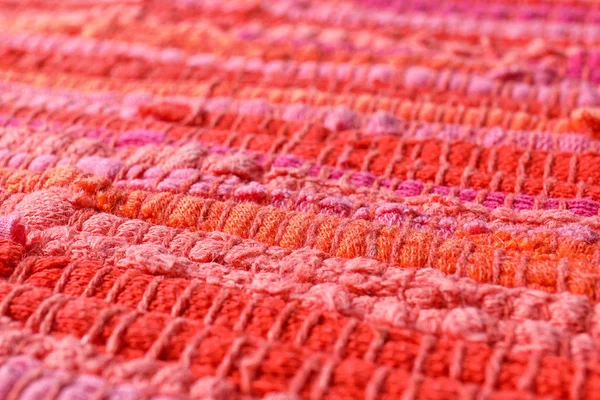 Textura de tecido de malha laranja e rosa como fundo, close-up — Fotografia de Stock