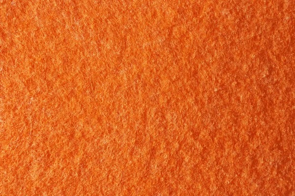 Текстура оранжевого войлока как фон, крупным планом — стоковое фото