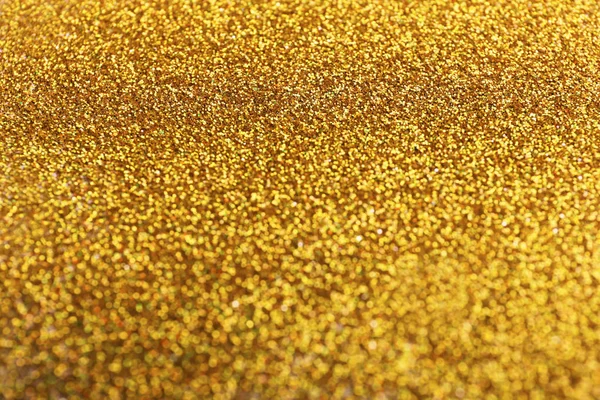 Vue rapprochée du fond scintillant de paillettes dorées — Photo