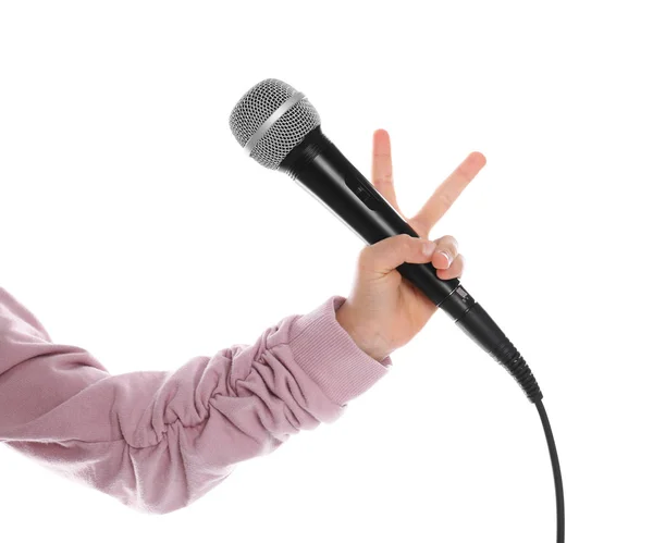 Niño sosteniendo micrófono sobre fondo blanco, primer plano — Foto de Stock