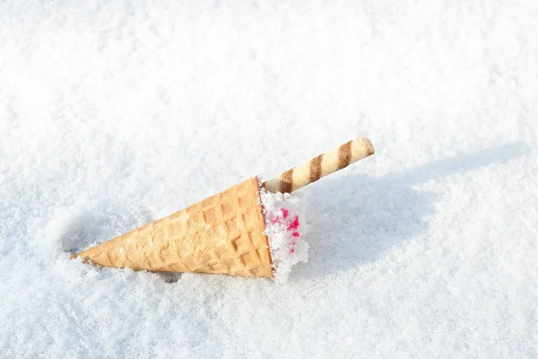 Waffle cone with ice cream on snow, space for text — Stock Photo, Image