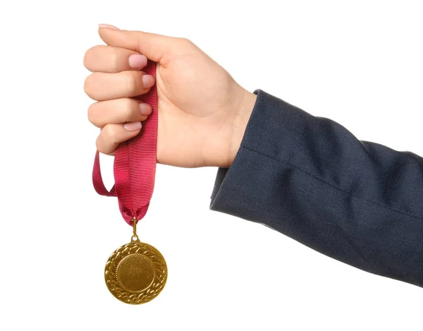 Woman holding golden medal on white background, closeup — Stock Photo, Image
