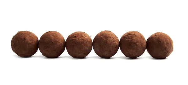 Delicious raw chocolate truffles on white background — Stock Photo, Image