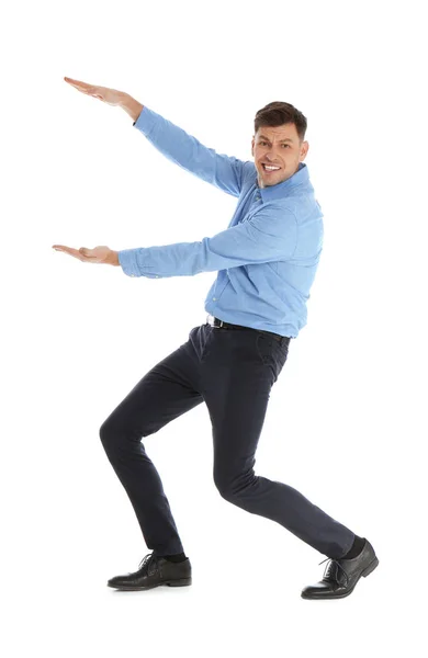 Homem emocional no escritório usar segurando algo no fundo branco — Fotografia de Stock