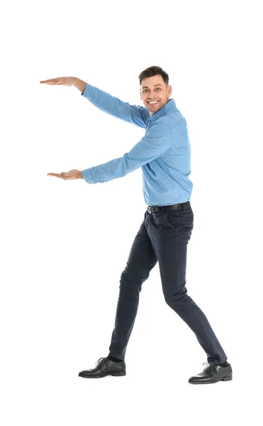 Man in office wear holding something on white background — Stock Photo, Image