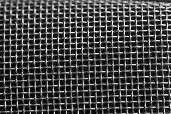 Metallnät av mikrofon som bakgrund, närbild. Musikutrustning — Stockfoto
