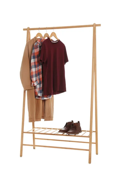 New wardrobe rack with stylish man's clothes and shoes on white background