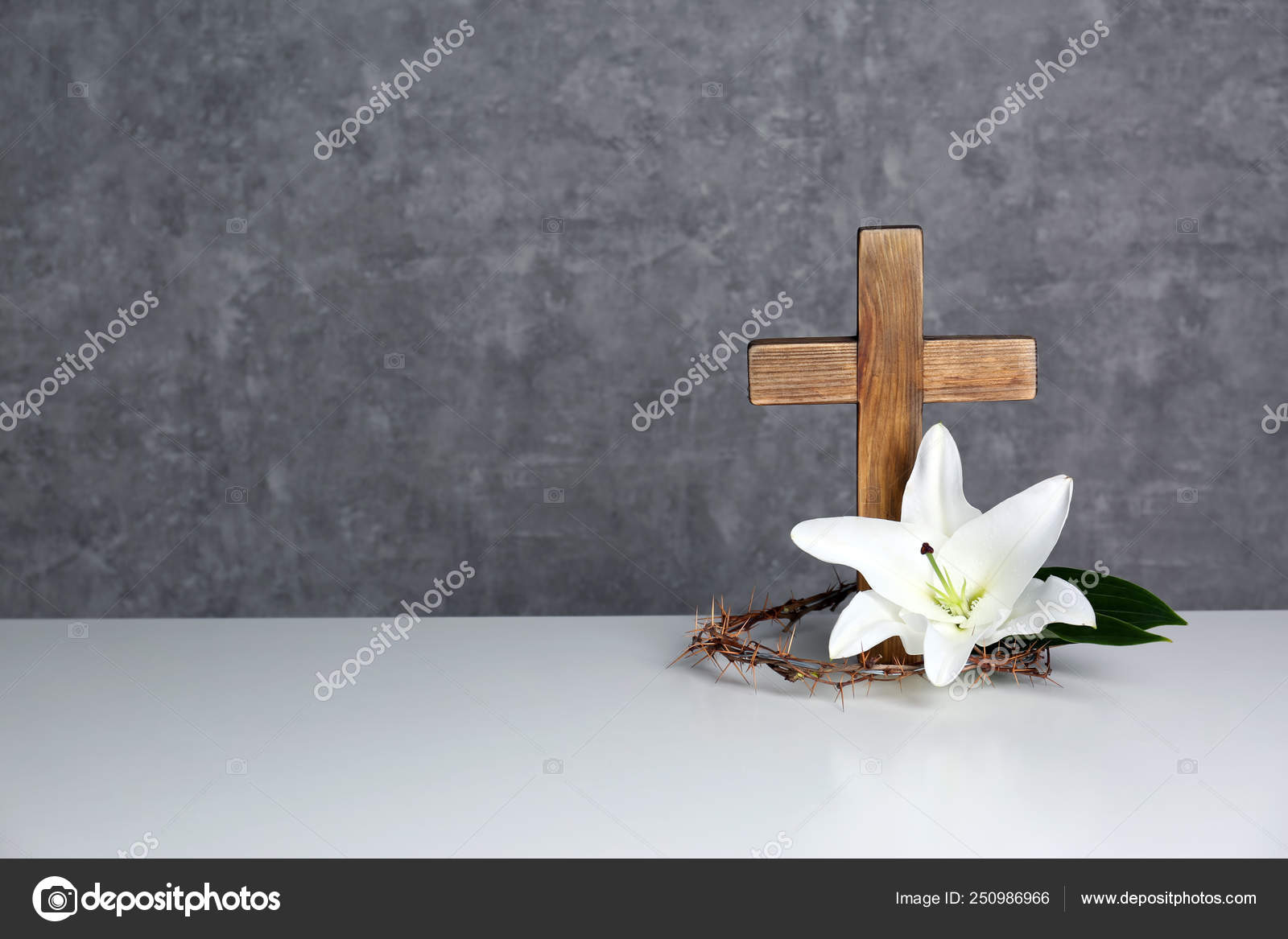 Wooden cross, crown of thorns and blossom lily on table against color  background, space for text Stock Photo by ©NewAfrica 250986966
