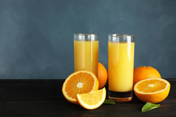 Composition with orange juice and fresh fruit on table, space for text — Stock Photo, Image