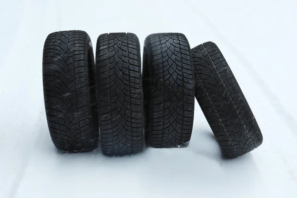 New winter tires on fresh snow outdoors — Stock Photo, Image