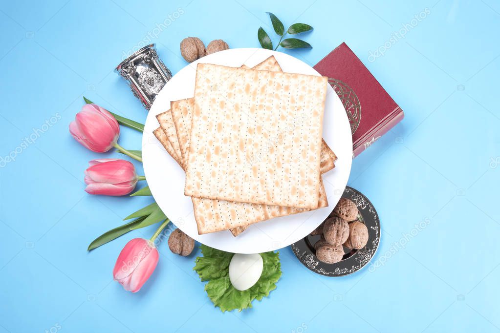 Composition with symbolic Passover (Pesach) items on color background, top view