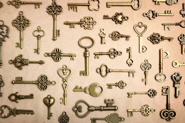 Old vintage keys on craft paper, flat lay