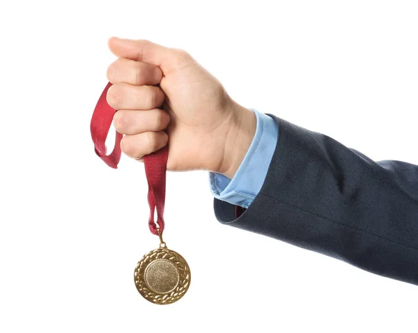 Man holding golden medal on white background, closeup — Stock Photo, Image