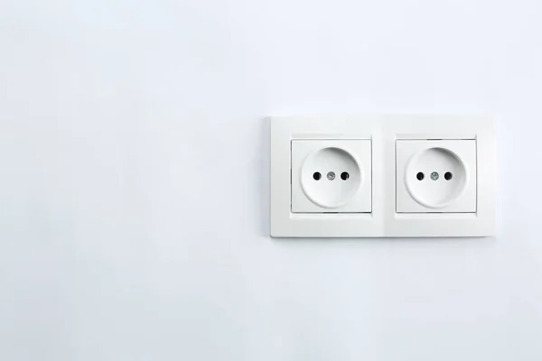 Power sockets on white background. Electrician\'s equipment