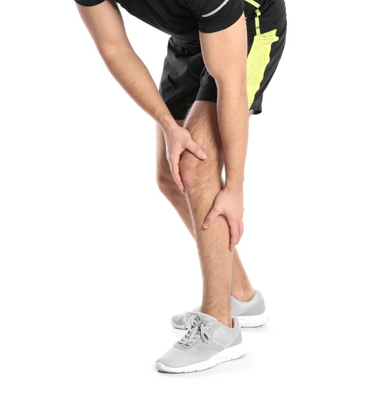 Человек, страдающий от боли в ногах на белом фоне, крупным планом — стоковое фото