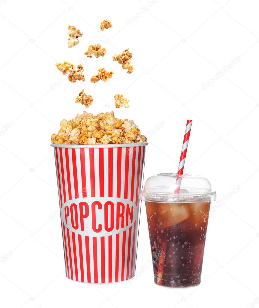 Carton cup with delicious caramel popcorn and iced cola on white background