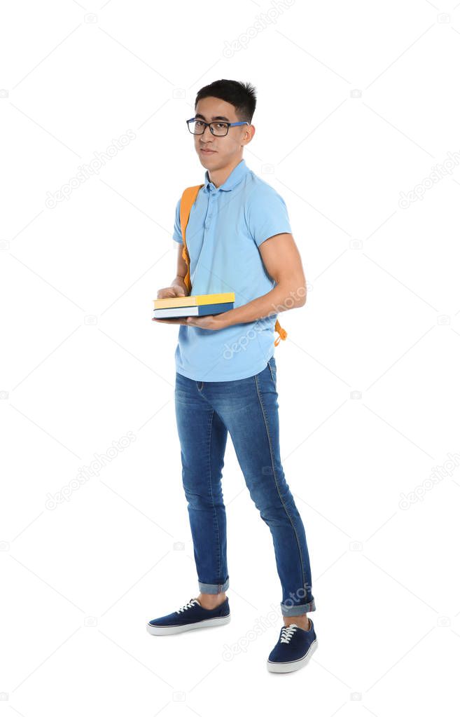Asian teenager boy with books on white background