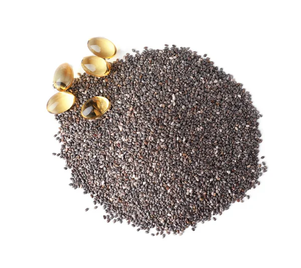 Pila de semillas de chía y cápsulas de aceite aisladas en blanco, vista superior —  Fotos de Stock