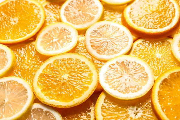 Fatias de citrinos frescos como fundo — Fotografia de Stock