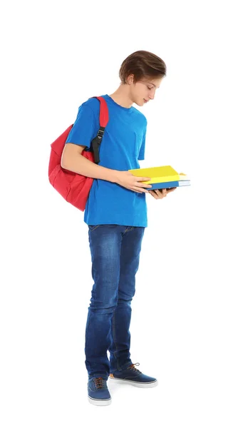 Bonito adolescente com livros sobre fundo branco — Fotografia de Stock