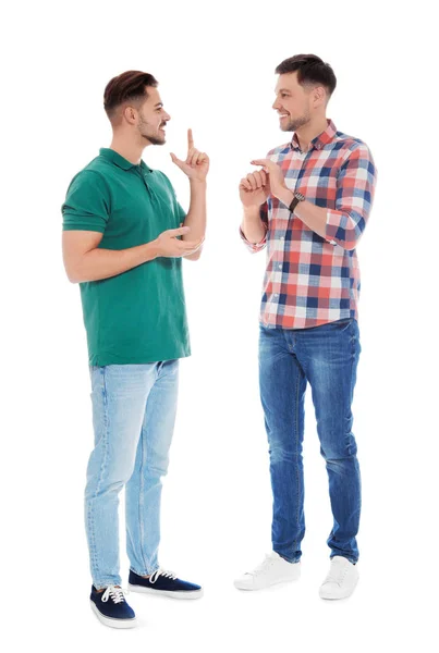 Amigos con discapacidad auditiva usando lenguaje de señas para la comunicación aislada en blanco — Foto de Stock