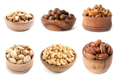 Beyaz arka plan üzerinde farklı organik fındık ile kase seti