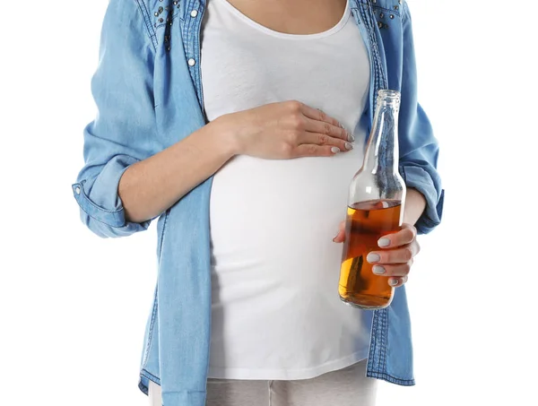 Future mother with bottle of alcohol drink on white background, closeup. Bad habits during pregnancy — Stock Photo, Image