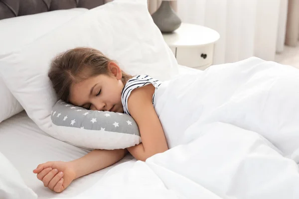 Cute girl with toy sleeping in bed — Stock Photo, Image