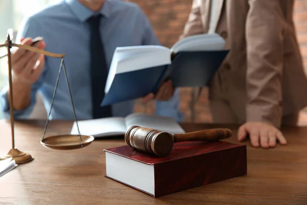 Notaries working at table in office, focus on judge gavel and book. Law and justice concept — Stock Photo, Image