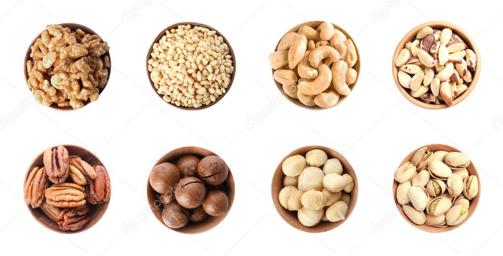 Set of bowls with different organic nuts on white background, top view