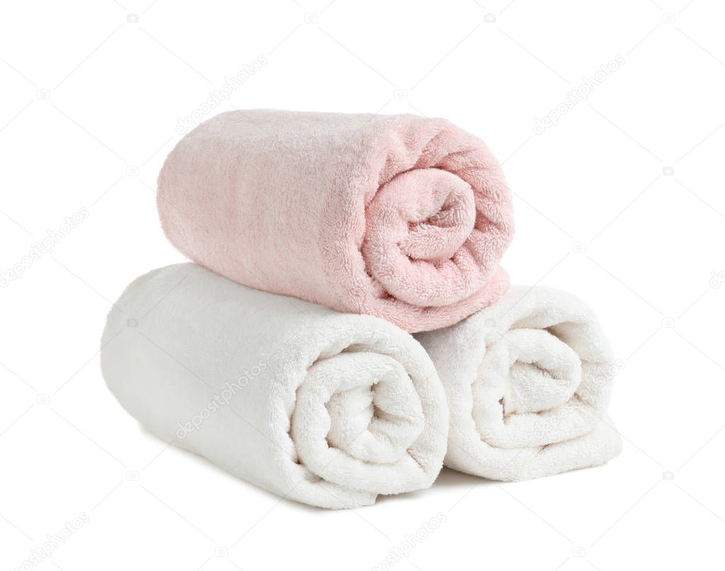 Rolled soft terry towels on white background