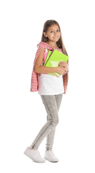 Pretty preteen girl with notebooks against white background — Stock Photo, Image