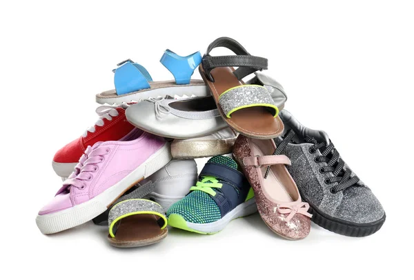 Montón de zapatos diferentes sobre fondo blanco —  Fotos de Stock