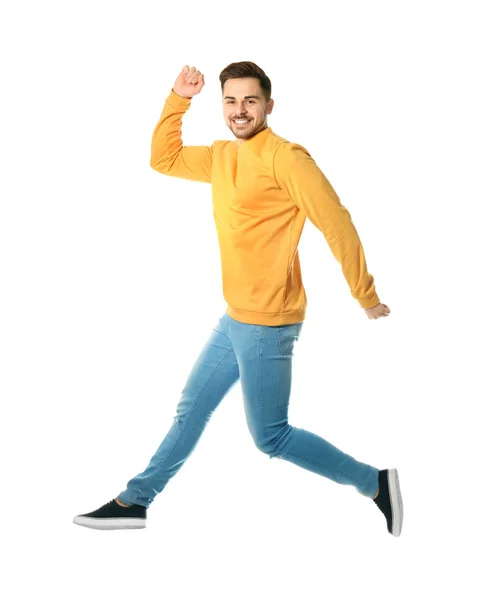 Full length portrait of happy handsome man jumping on white background — Stock Photo, Image