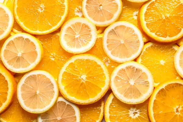Řezy z citrusových plodů jako pozadí, pohled shora — Stock fotografie