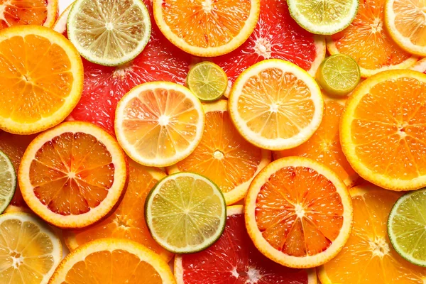 以新鲜柑橘类水果片为背景, 最受关注 — 图库照片