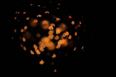 Koyu arka plan üzerinde bulanık görünüm Altın ışık. Bokeh etkisi