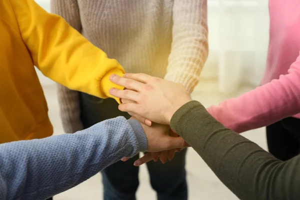 Group of volunteers putting their hands together, closeup — Stock Photo, Image