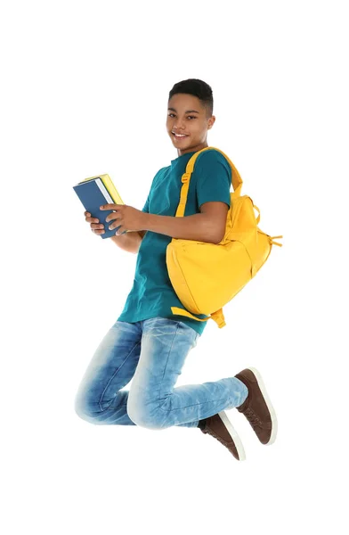 Adolescente afroamericano con libros sobre fondo blanco —  Fotos de Stock