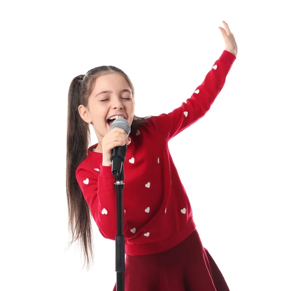 Niña cantando en el micrófono sobre fondo blanco —  Fotos de Stock