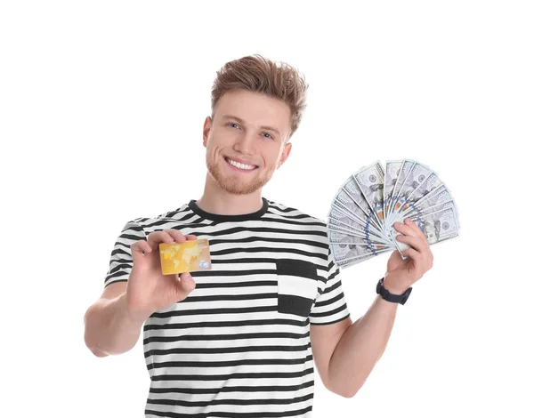 Glücklicher junger Mann mit Geld und Kreditkarte auf weißem Hintergrund — Stockfoto