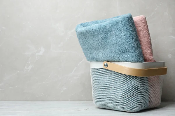 Basket of fresh towels on table. Space for text — Stock Photo, Image