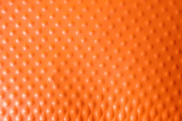 Konsistens av orange plastmugg som bakgrund, närbild — Stockfoto