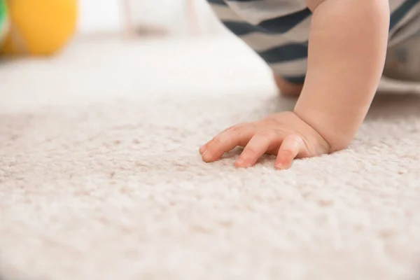Cute little baby crawling on carpet indoors, closeup with space for text — Stock Photo, Image