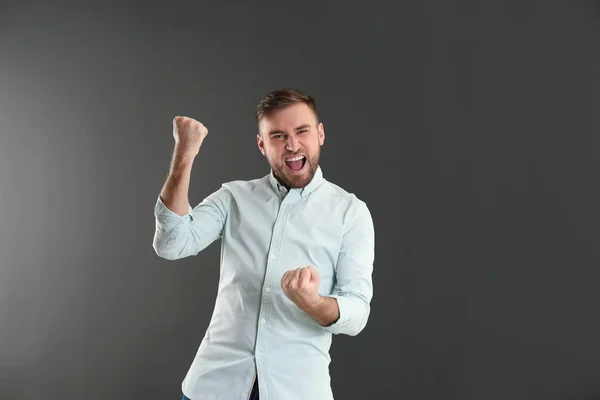 Portrait of emotional young man on grey background. Space for text — Stock Photo, Image